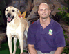 Brian Gisi training golden Labrador dog
